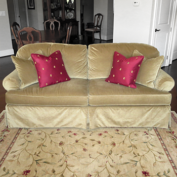 Sofa with pillows on Rug